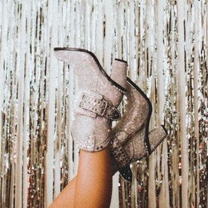 Bedazzled cowgirl boots with heel and big buckle